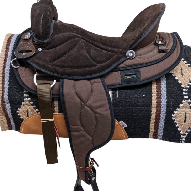 This exquisitely designed synthetic saddle showcases a rich, all-brown hue accented with black binding. The Big Horn synthetic model is characterized by a 5" cantle, and its seat is adorned with padded suede that extends seamlessly to the jockeys. Ensuring optimal tie functionality for your horse, a 7/8 position single front stainless steel dee is incorporated. Remarkably lightweight at 15 lbs, this saddle stands among the lightest options in the western saddle industry. The Ralide® material, coupled with laced suede cushioned foot pads, adds both durability and comfort to this exceptional piece.