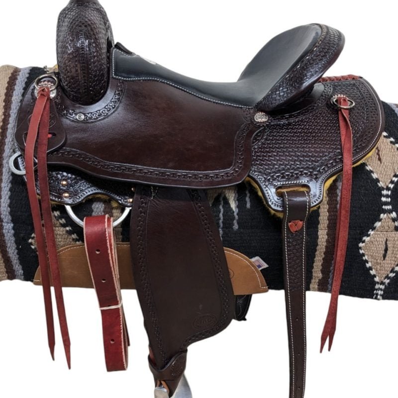 Saddle Features From Clydesdales to Belgians, this HR Saddlery draft trail saddle will work perfect for any of your heavy horse breeds! Dark chocolate leather Padded black seat Mother hubbard, cut-out back skirt In-skirt rigging Latigo leather saddle strings Basket stamp and carlos border tooling Metal stirrups and rubber grippers Includes a rear cinch Smooth leather Saddle Specifications Cantle Height: 4" Skirt Length: Approx. 26-27" (Ranges depending on seat size) Horn Height: 3.5" Weight: Approx. 30 lbs Gullet: 8"