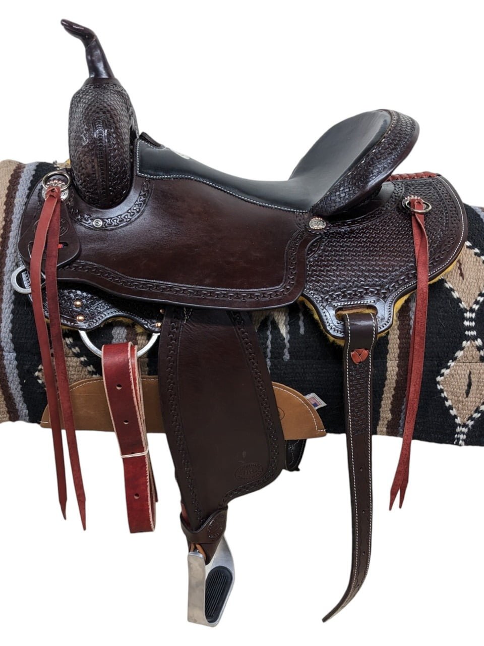 Saddle Features From Clydesdales to Belgians, this HR Saddlery draft trail saddle will work perfect for any of your heavy horse breeds! Dark chocolate leather Padded black seat Mother hubbard, cut-out back skirt In-skirt rigging Latigo leather saddle strings Basket stamp and carlos border tooling Metal stirrups and rubber grippers Includes a rear cinch Smooth leather Saddle Specifications Cantle Height: 4" Skirt Length: Approx. 26-27" (Ranges depending on seat size) Horn Height: 3.5" Weight: Approx. 30 lbs Gullet: 8"