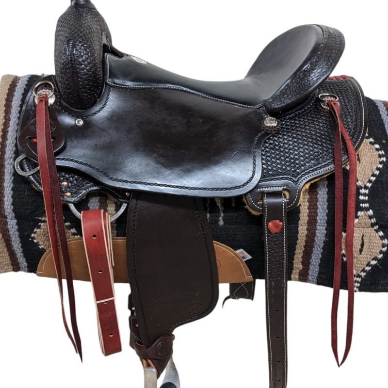 Saddle Features From Clydesdales to Belgians, this HR Saddlery draft trail saddle will work perfect for any of your heavy horse breeds! Dark chocolate leather Padded black seat Mother hubbard, cut-out back skirt In-skirt rigging Latigo leather saddle strings Basket stamp and rope border tooling Metal stirrups and rubber grippers Includes a rear cinch Smooth leather Saddle Specifications Cantle Height: 4" Skirt Length: Approx. 26" Horn Height: 3.5" Weight: Approx. 30 lbs Tree Size: 17.5" Seat Size: 17" Gullet: 8"
