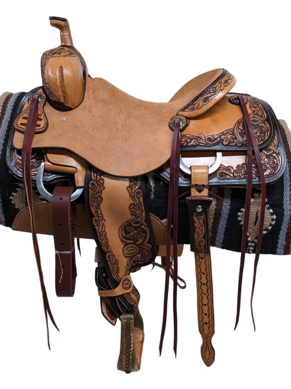 Saddle Features Handcrafted leaf and acorn tooling Antique finish and border trim Natural leather Jeremiah Watt Conchos Rough-out seat jockey and seat for grip Smooth fenders Hard Seat Matching Rear Cinch Double loop latigo keeper Hoof pick holder Saddle strings Saddle Specifications Cantle height: 3.5" Skirt Length: Approx. 28.5" Approx. Weight: 40 lbs Seat Size: 15.5" Tree Size: 16" Gullet: 7"